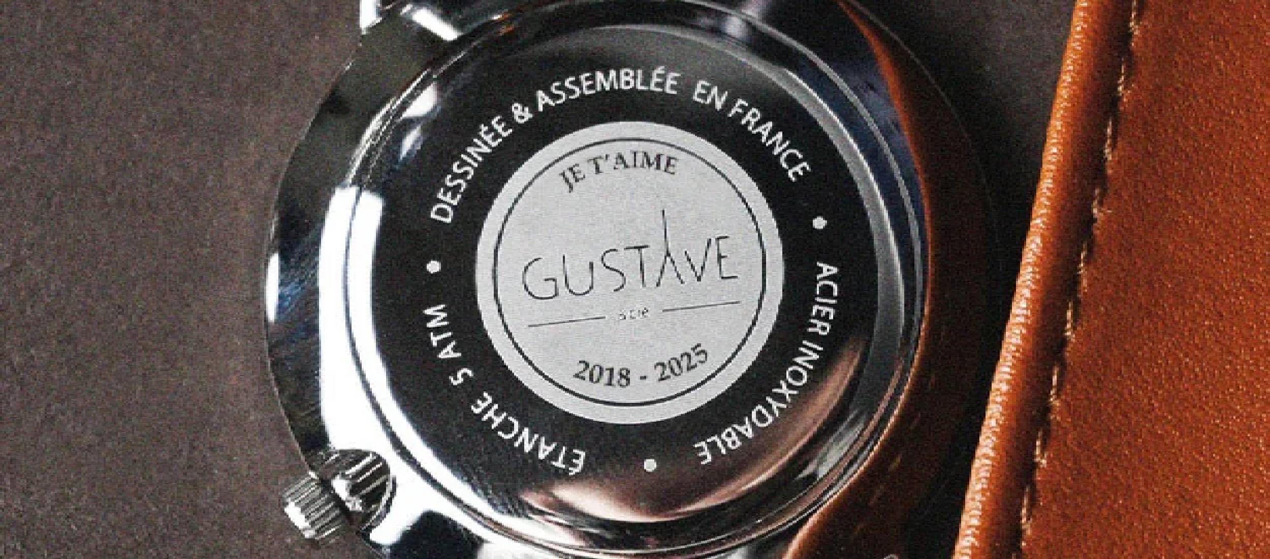 montre de gustave et cie avec une gravure 